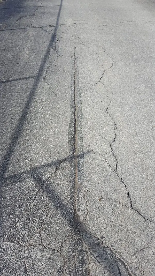 Commercial asphalt repair at Permacon facility - Andy's Asphalt Sealing