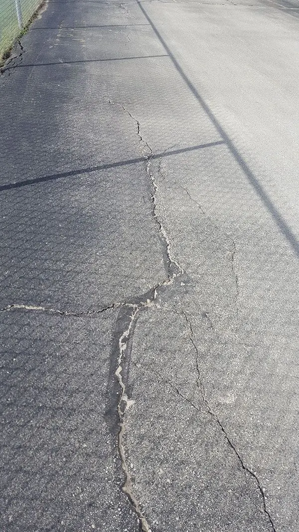 Commercial asphalt repair at Permacon facility - Andy's Asphalt Sealing