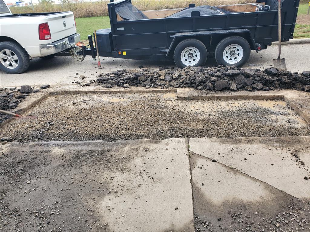 Commercial asphalt repair at Permacon facility - Andy's Asphalt Sealing